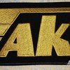 AKA Logo (Yellow Threads)